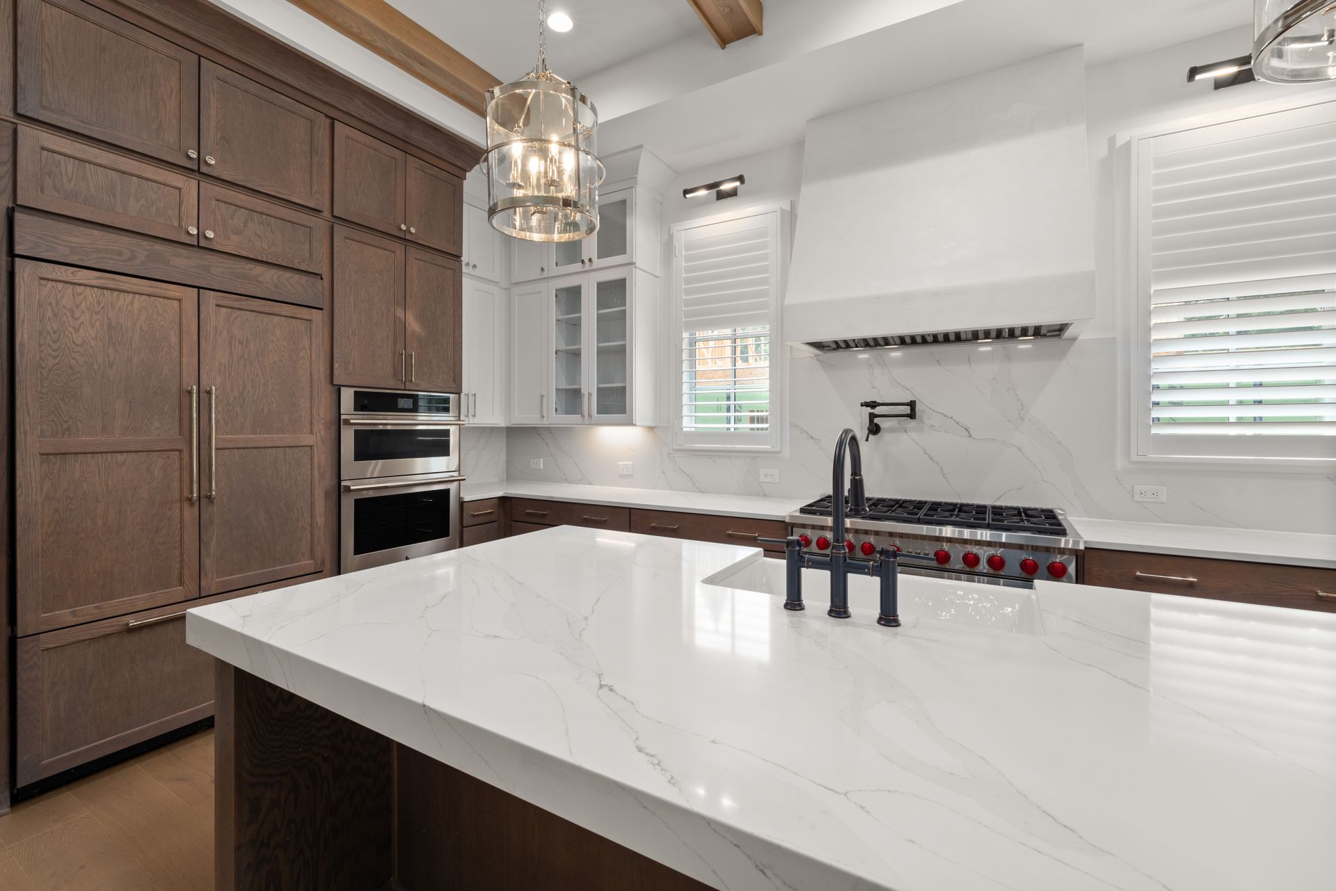 Kitchen with a natural stone countertop and sink